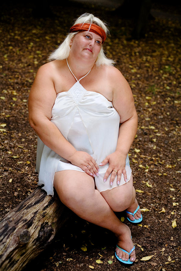 Portrait of Overweight Woman Sitting on Log in Forest Photograph by Elkor