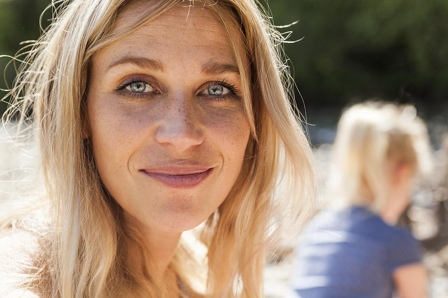 Portrait of smiling blond woman with freckles Photograph by Westend61