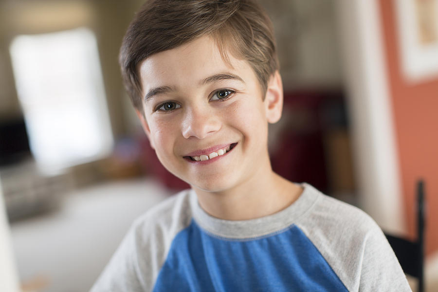 Portrait of smiling boy at home Photograph by Steve Prezant