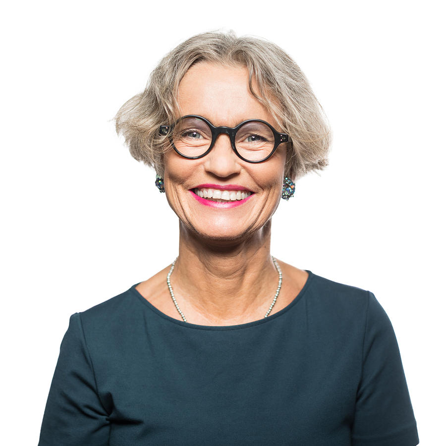 Portrait of smiling senior woman with eyeglasses Photograph by Alvarez