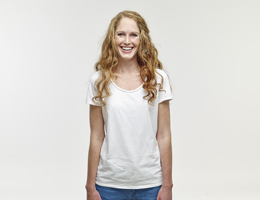 Portrait of smiling young woman with long blond hair Photograph by Westend61