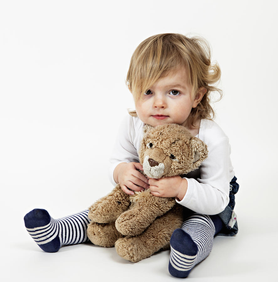 Portrait of toddler holding teddy bear Photograph by Compassionate Eye Foundation/Natasha Alipour Faridani