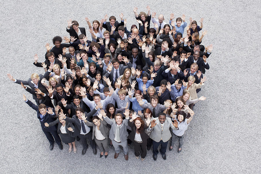 Portrait of waving business people Photograph by Martin Barraud