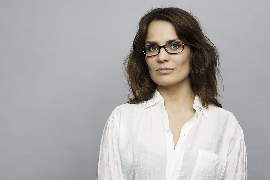 Portrait of woman with glasses in white shirt Photograph by Robin Skjoldborg