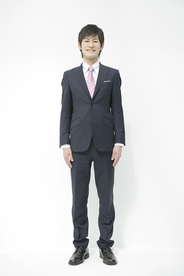Portrait of young businessman, full length Photograph by Indeed
