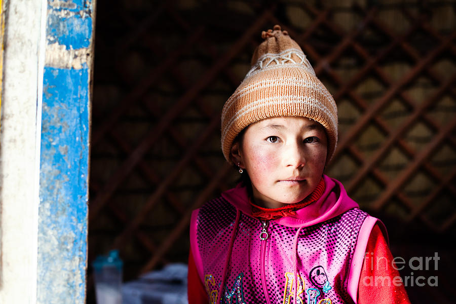 Portrait of young kyrgyz girl inside a yurt China Photograph by Matteo Colombo