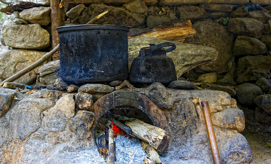 Pots on the stove Photograph by Alexey Stiop