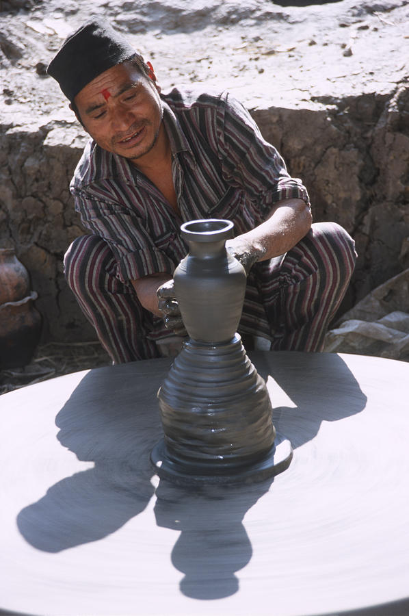 Nepal Photograph - Potter at work in Bhaktapur by Richard Berry Nepal Photograph - Potter at work in Bhaktapur by Richard Berry
