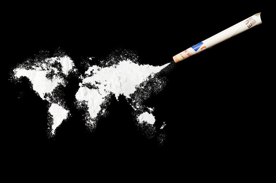 Powder drug like cocaine in the shape of the world Photograph by Eyegelb