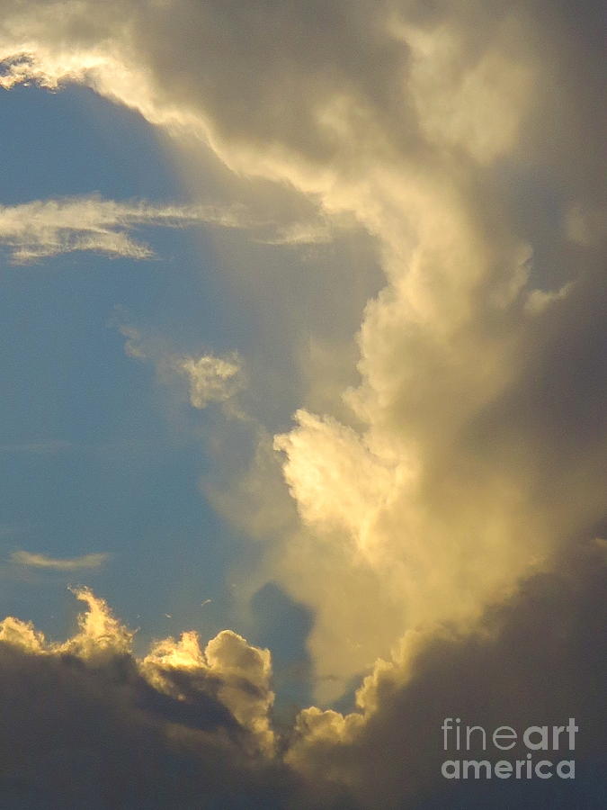 Powerful cloud pattern at Sunset. Photograph by Robert Birkenes
