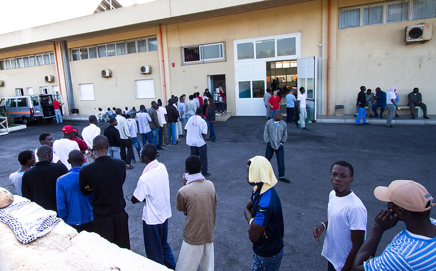 Pozzallo, Sicily: African Migrants Wait for Breakfast at Reception Center Photograph by JannHuizenga