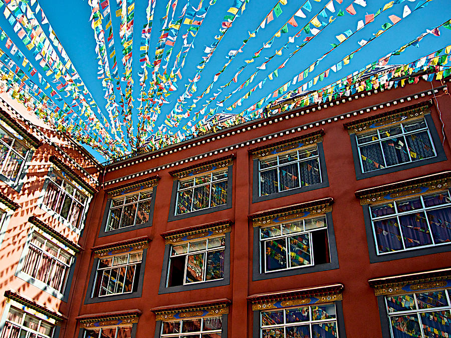 Tibet Photograph - Prayer Flag Reflections in Windows of  Thangka Hotel in Lhasa-Tibet    by Ruth Hager
