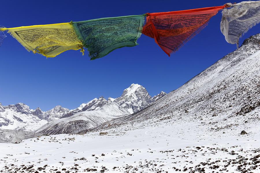 Mountain Photograph - Prayer flags and snowy mountains in the Everest Region of Nepal by Robert Preston