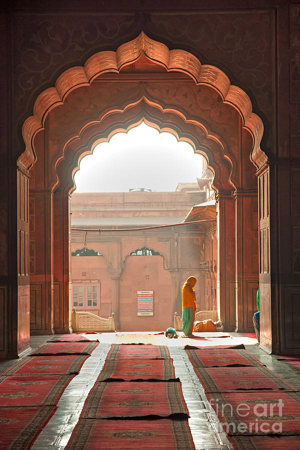 Praying at the Jama Masjid Mosque - old Delhi Photograph by Luciano Mortula