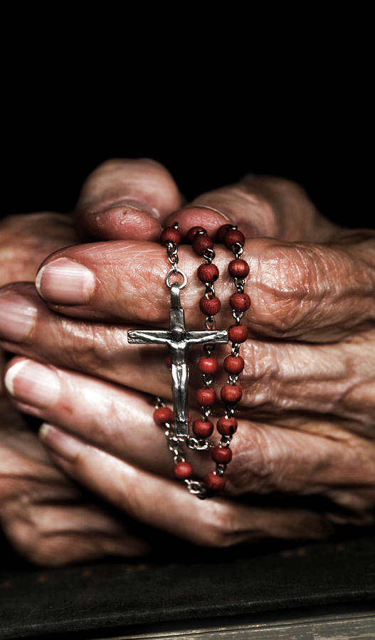 Praying with Rosary Beads Photograph by spxChrome