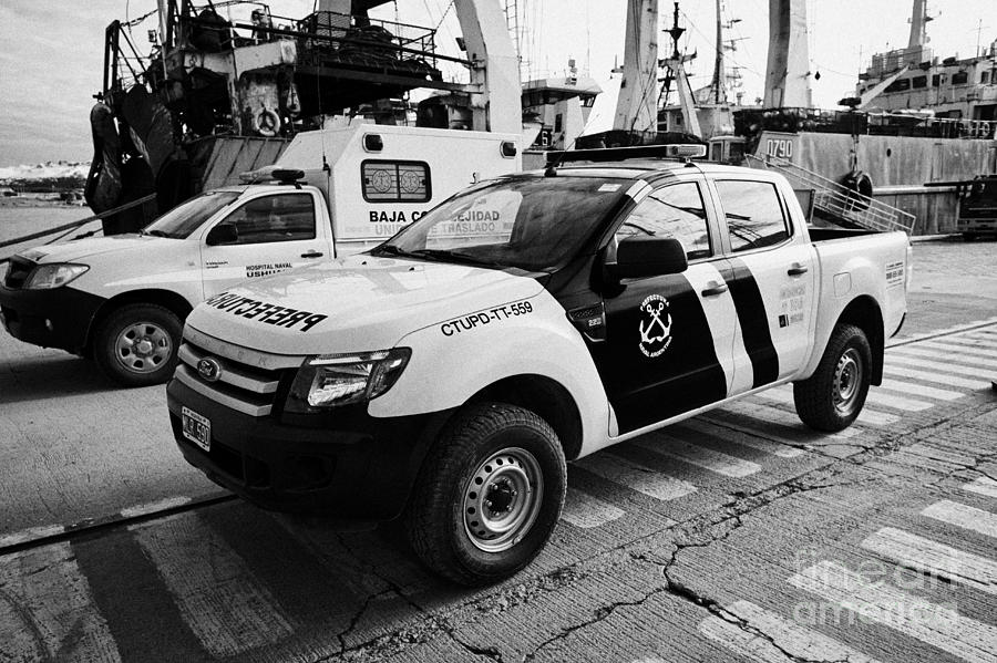 Pier Photograph - prefectura naval argentina ford ranger patrol vehicle on pier in Ushuaia Argentina by Joe Fox
