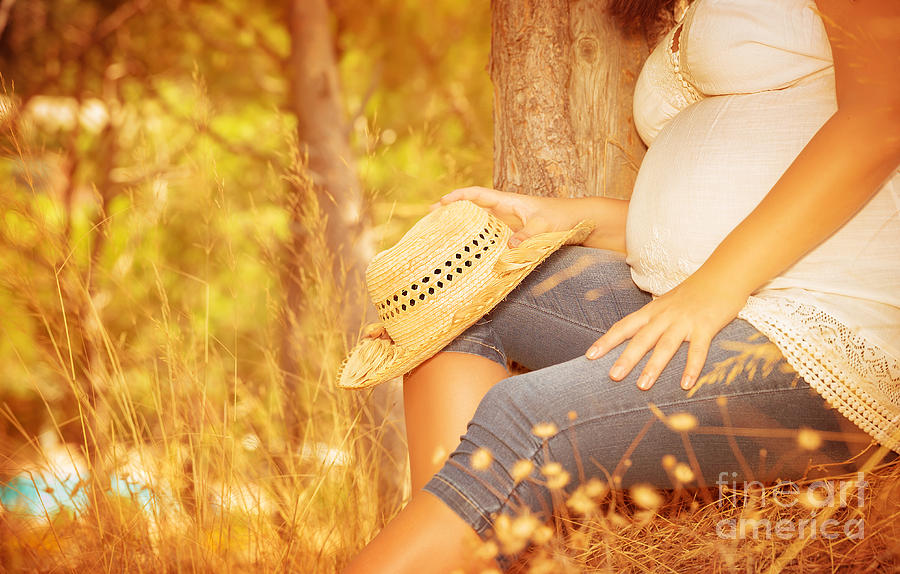 Pregnant girl in autumnal park Photograph by Anna Om