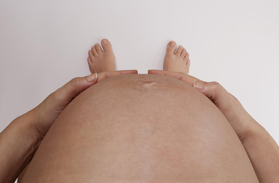Pregnant holding the belly Photograph by Erlon Silva - TRI Digital