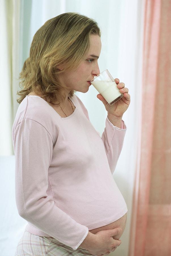 Pregnant Woman Drinking A Glass Of Milk Photograph by Lea Paterson/science Photo Library