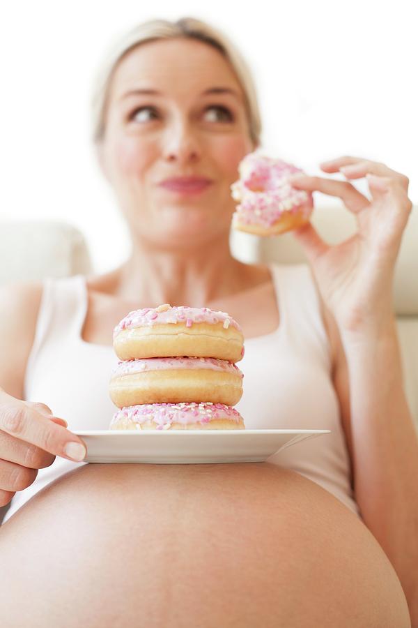 Pregnant Woman Eating Doughnuts Photograph By Ian Hooton Science Photo Library Pixels