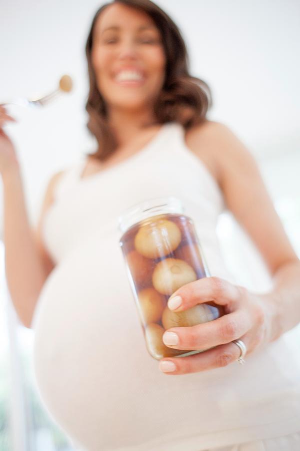Pregnant Woman Eating Pickled Onions Photograph by Ian Hooton/science Photo Library