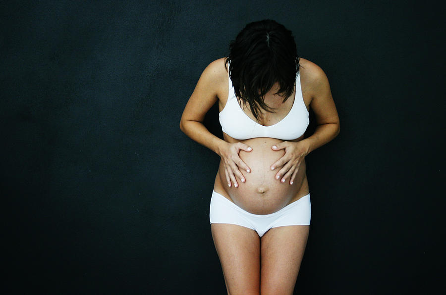 Pregnant woman in white underwear Photograph by © Nico Piotto