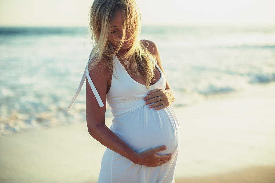 Pregnant woman on the beach Photograph by Danilovi
