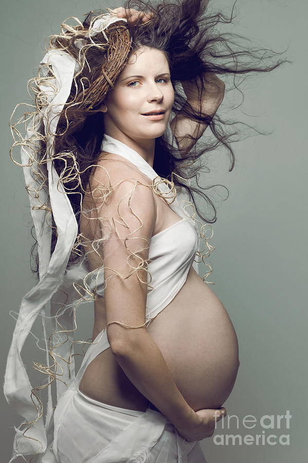 Parenthood Movie Photograph - Pregnant woman with long curly hair. by Yaromir Mlynski