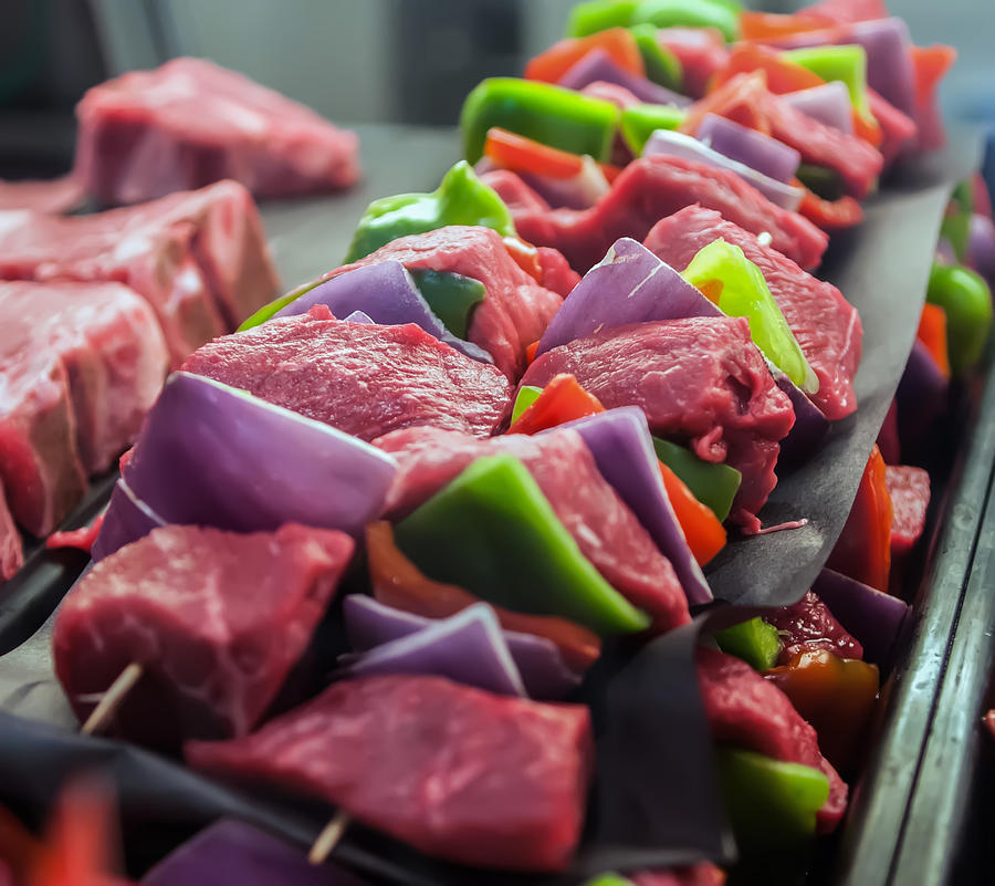Preparing fresh beef steak shishkabobs with vegetables Photograph by Alex Grichenko