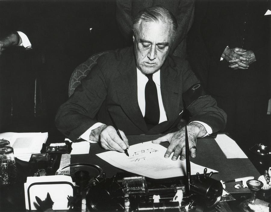 President Franklin Roosevelt Signing Photograph by Everett