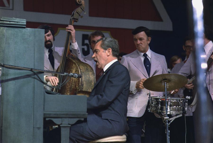 President Nixon Singing And Playing Photograph by Everett