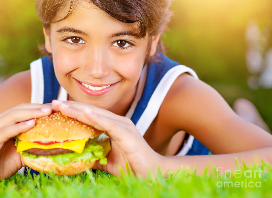 Pretty boy eat burger outdoors Photograph by Anna Om