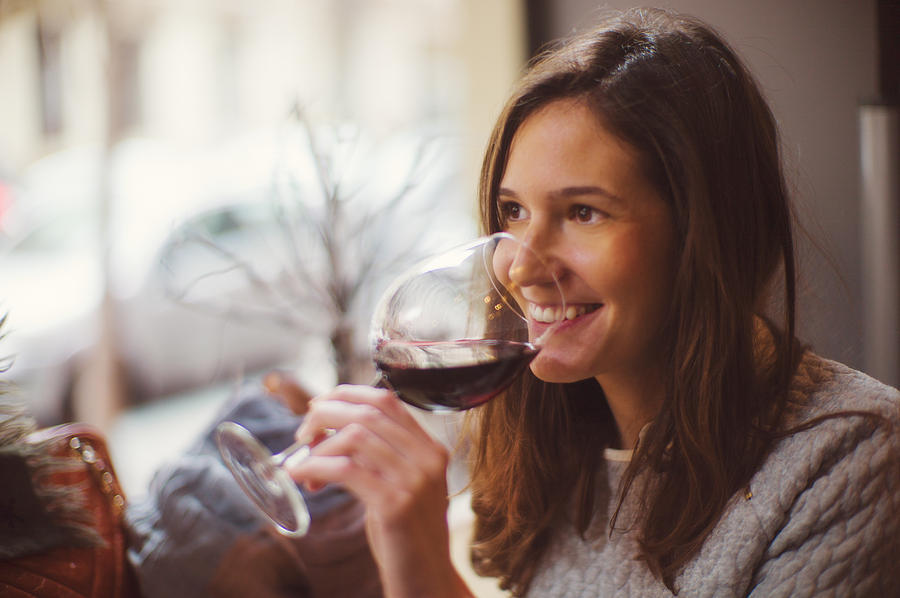 Pretty happy woman drinking wine Photograph by Photo by Rafa Elias