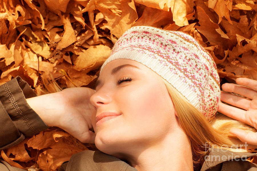 Pretty woman sleeping on fall foliage Photograph by Anna Om