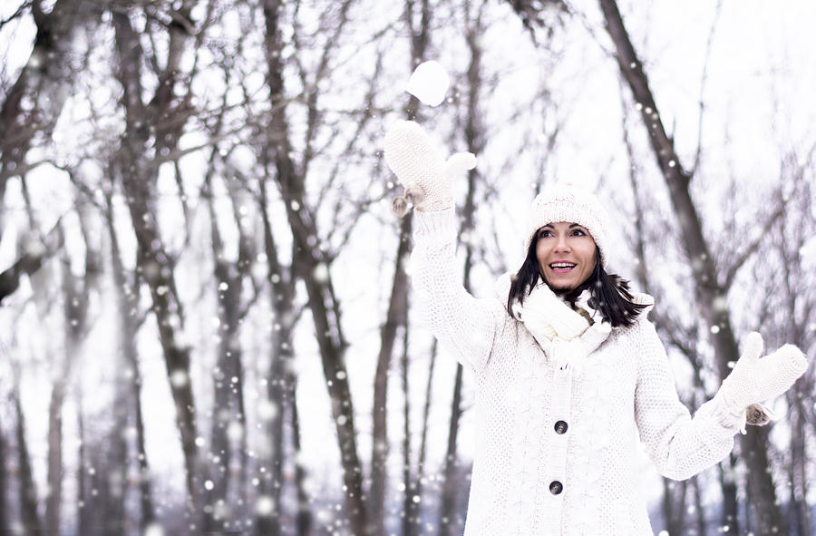 Winter Photograph - Pretty woman throwing snowball by Newnow Photography By Vera Cepic