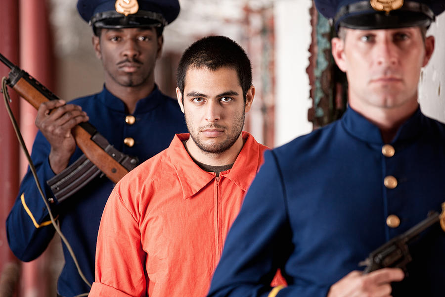 Prisoner Escorted By Prison Guards Photograph by Avid_creative