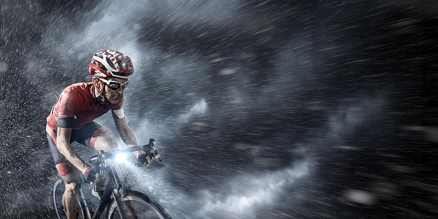 Professional cyclist under stormy sky Photograph by Dmytro Aksonov