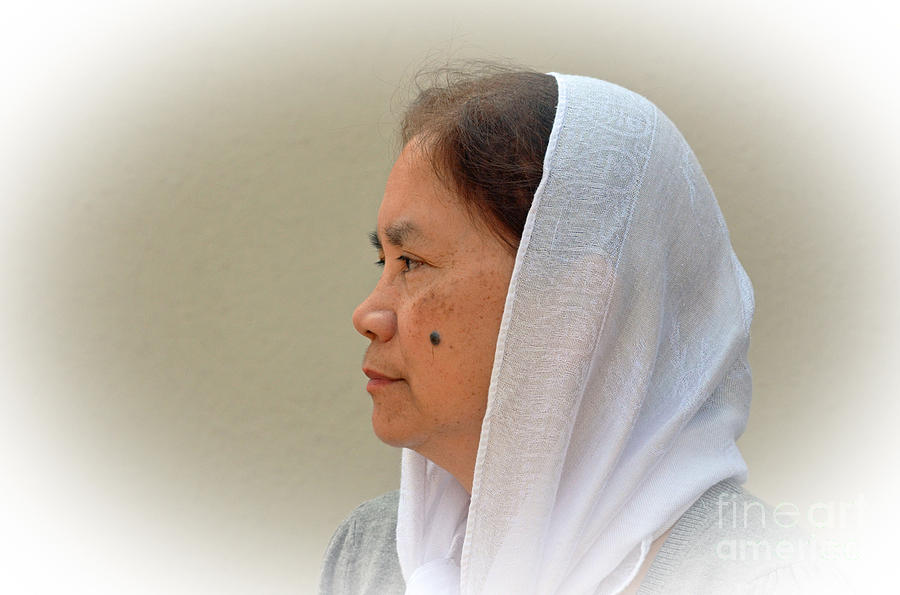 Profile Of A Filipina Woman With A Mole On Her Cheek Wearng A Scarf