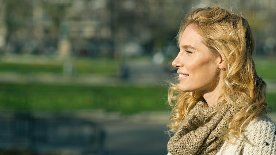 Profile of an beautiful blondy smiling woman looking away Photograph by MStudioImages