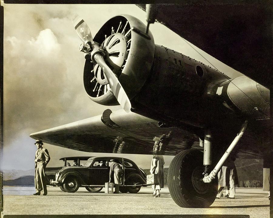 Propeller Plane With Passengers And Car Photograph by George Hurrell