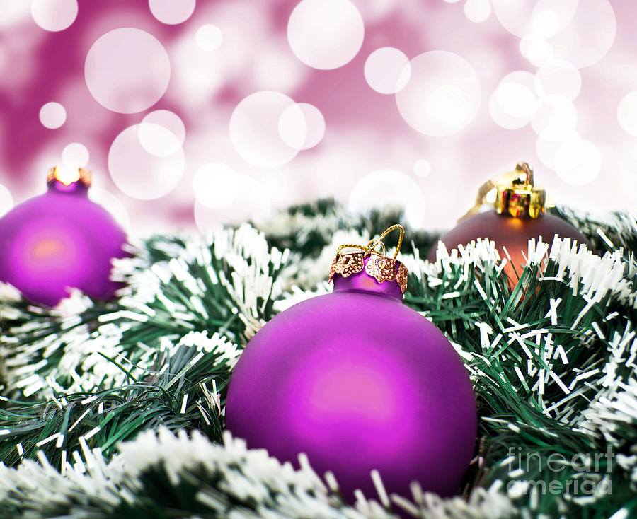 Purple christmas ornament ball against purple bokeh background Photograph by Aleksandar Mijatovic