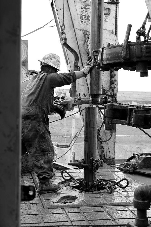 Oil Rig Photograph - Putting It Together by Jason Drake