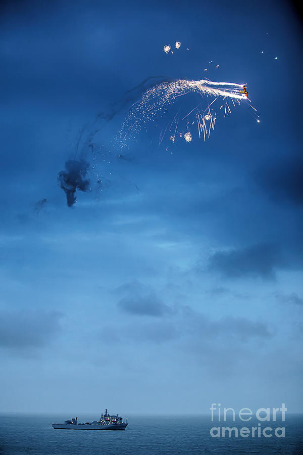 Flaming Plane Over Warship Photograph by Simon Bratt