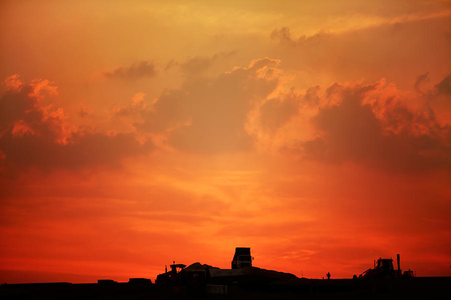Qatar construction sunset Photograph by Paul Cowan