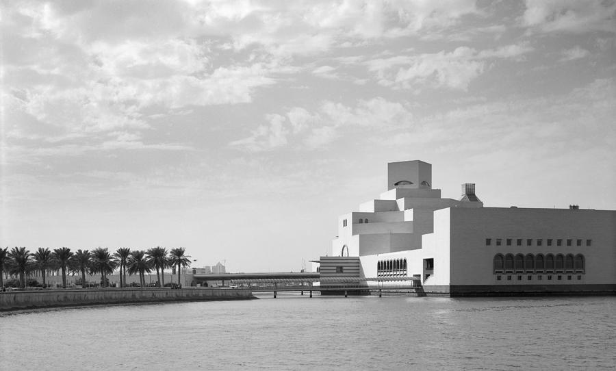 Qatar museum and clouds Photograph by Paul Cowan