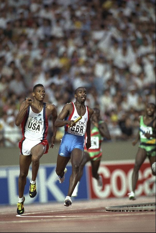 Quincy Watts of the USA and Derek Redmond of Great Britain in action in the 4 x 400 Metres Relay Photograph by Mike Powell