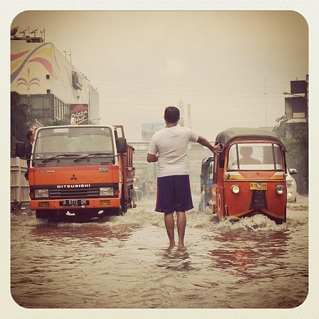 People Photograph - Racing Flooded...go...go...go... #flood by Dani Daniar