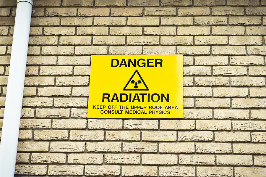 Brick Photograph - Radiation warning by Tom Gowanlock