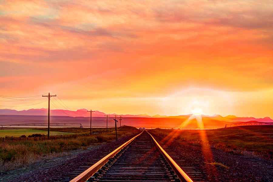 Sunset Photograph - Rails to the Red Sky by John Lee
