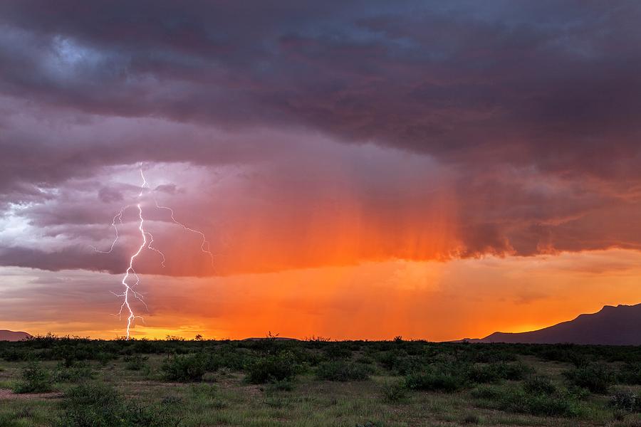 Rain Storm At Sunset Photograph by Roger Hill